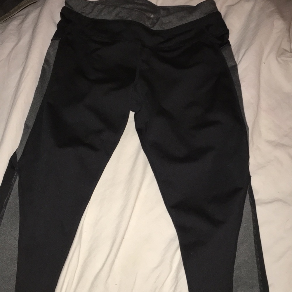Black and grey compression pants cropped at ankle